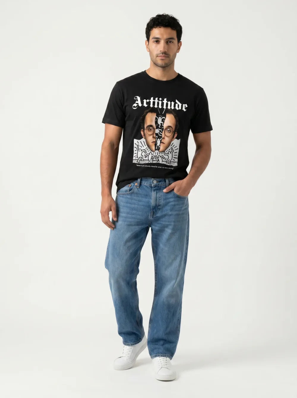 Black tee with a monochrome split-face portrait print, mid-wash straight jeans, white sneakers